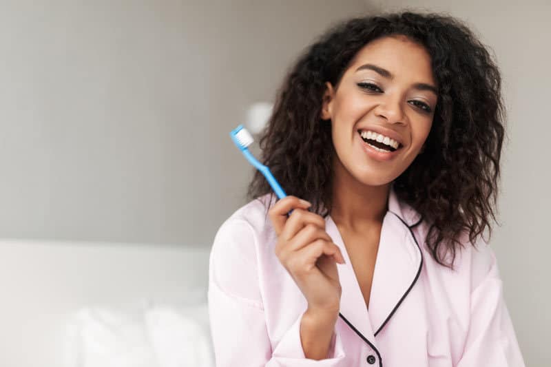 Lady Brushing Teeth